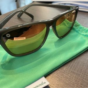 Light Grey Knockaround sunglasses with orange mirror lenses